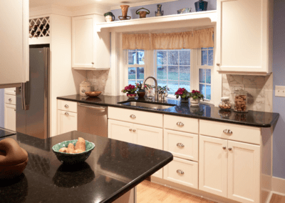White kitchen cabinets and black countertop | Country Cabinets