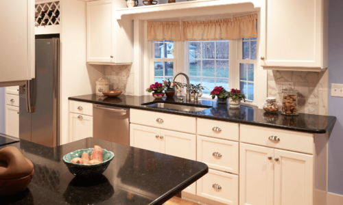 White kitchen cabinets and black countertop | Country Cabinets